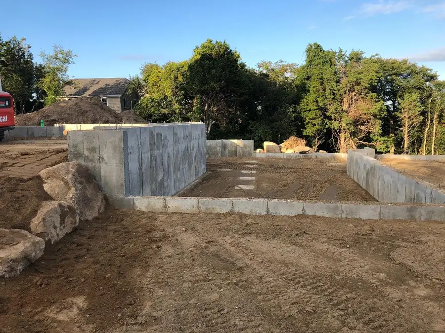Foundation walls excavated and backfilled