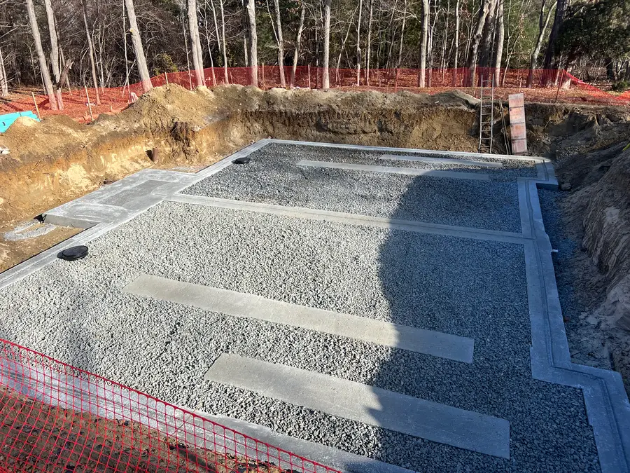 Gravel leaching system with orange safety fence